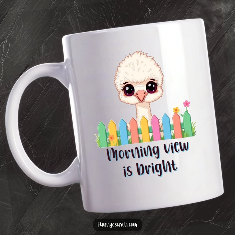 Funny fluffy ostrich with wide, happy eyes peeking curiously over a colorful garden fence on a mug, great for gifts.