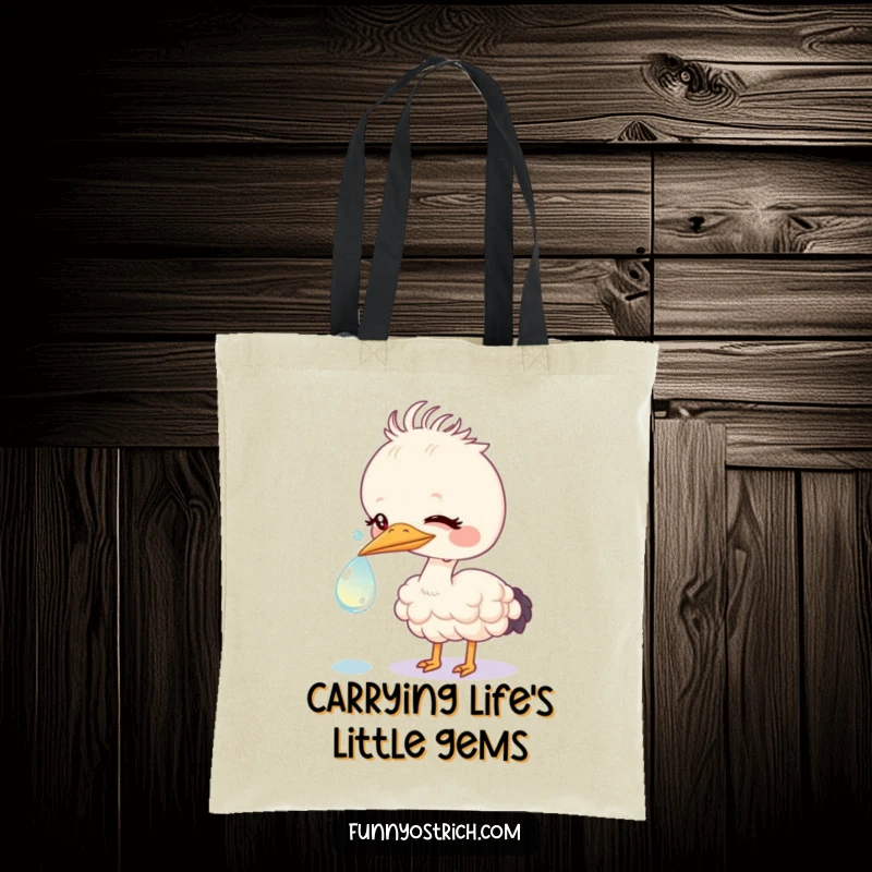 Funny kawaii ostrich nudging a large, sparkling dewdrop, depicted on a durable and stylish tote bag.